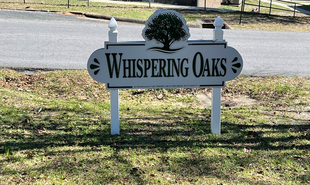 Whispering Oaks property sign